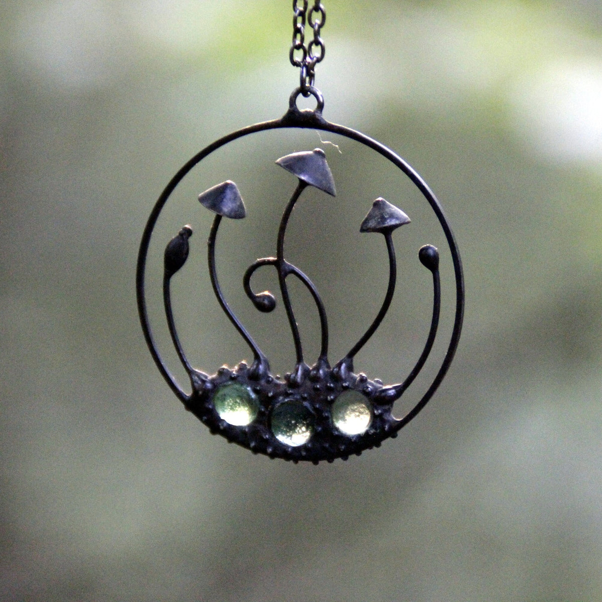 Green Glass Mushroom Necklace – Blackened Copper Round Forest Pendant – Botanical Fungi