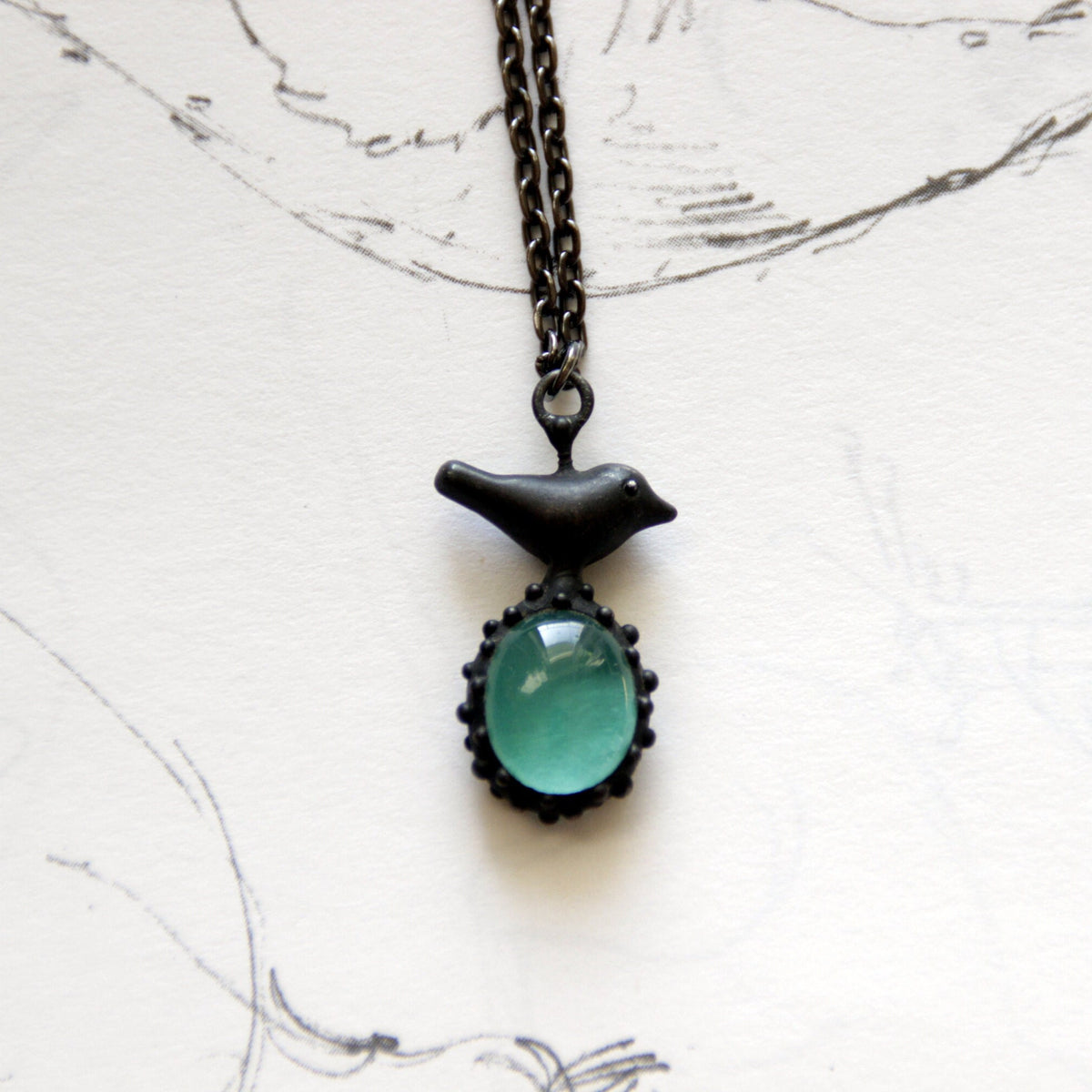 Teal Blue Glass Bird Necklace – Blackened Copper