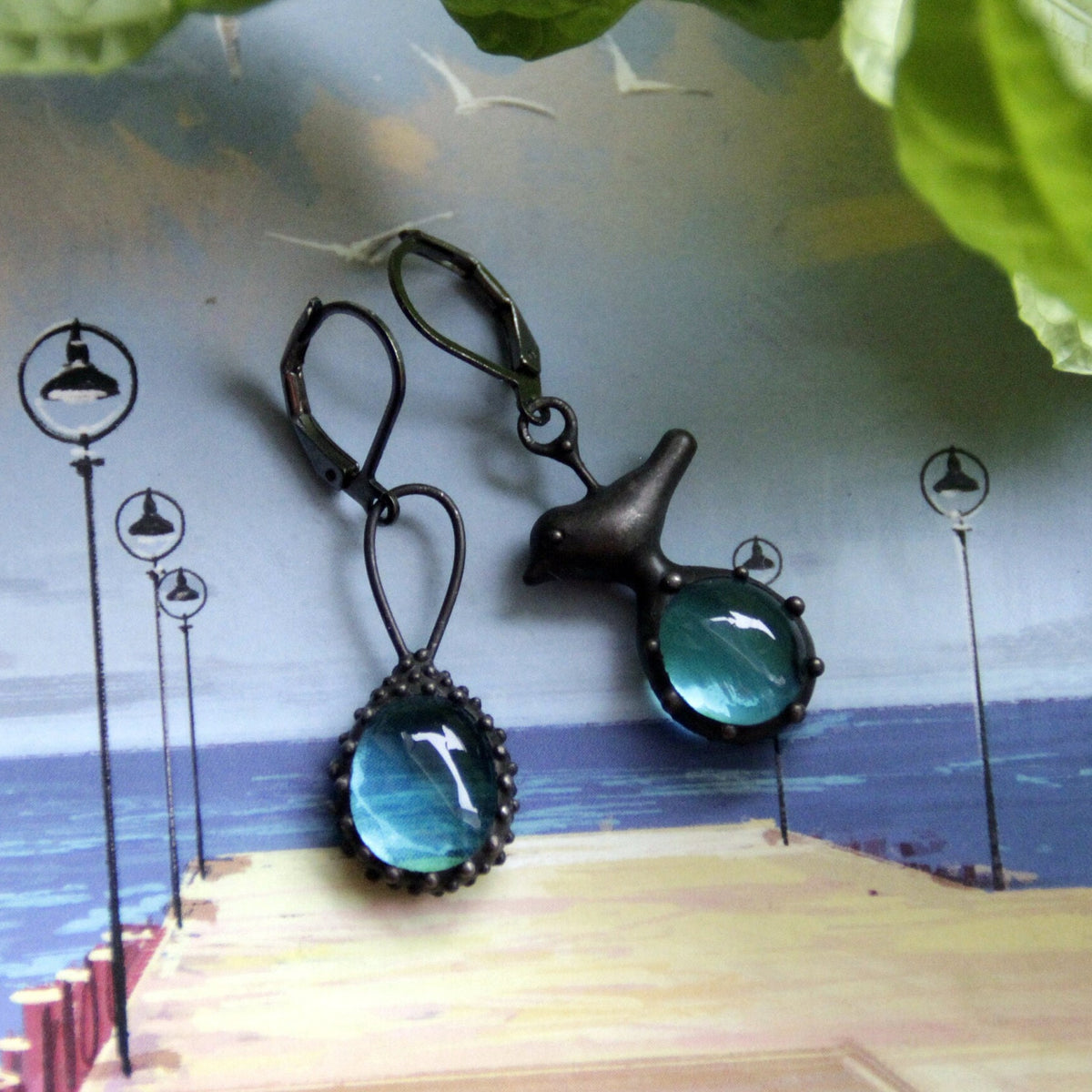 Blue Glass Asymmetrical Bird Earrings – Blackened Copper