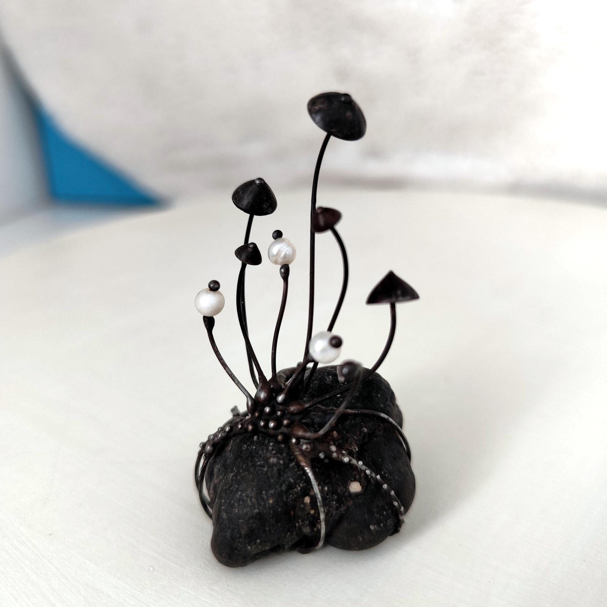 White Pearl Mushroom Sculpture on Baltic Sea Stone – Blackened Copper