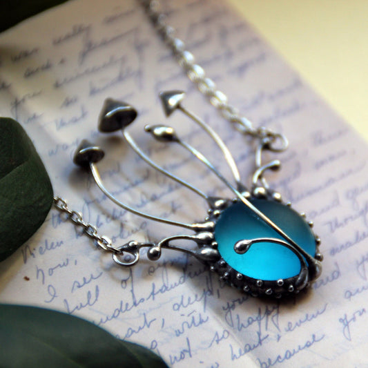 Frosted Blue Glass Mushroom Necklace – Silver Tone