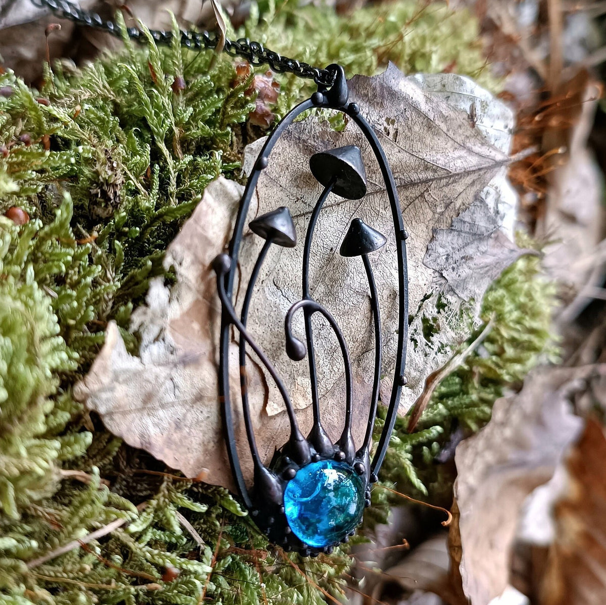 Blue Glass Mushroom Necklace – Blackened Copper Oval Forest Pendant – Botanical