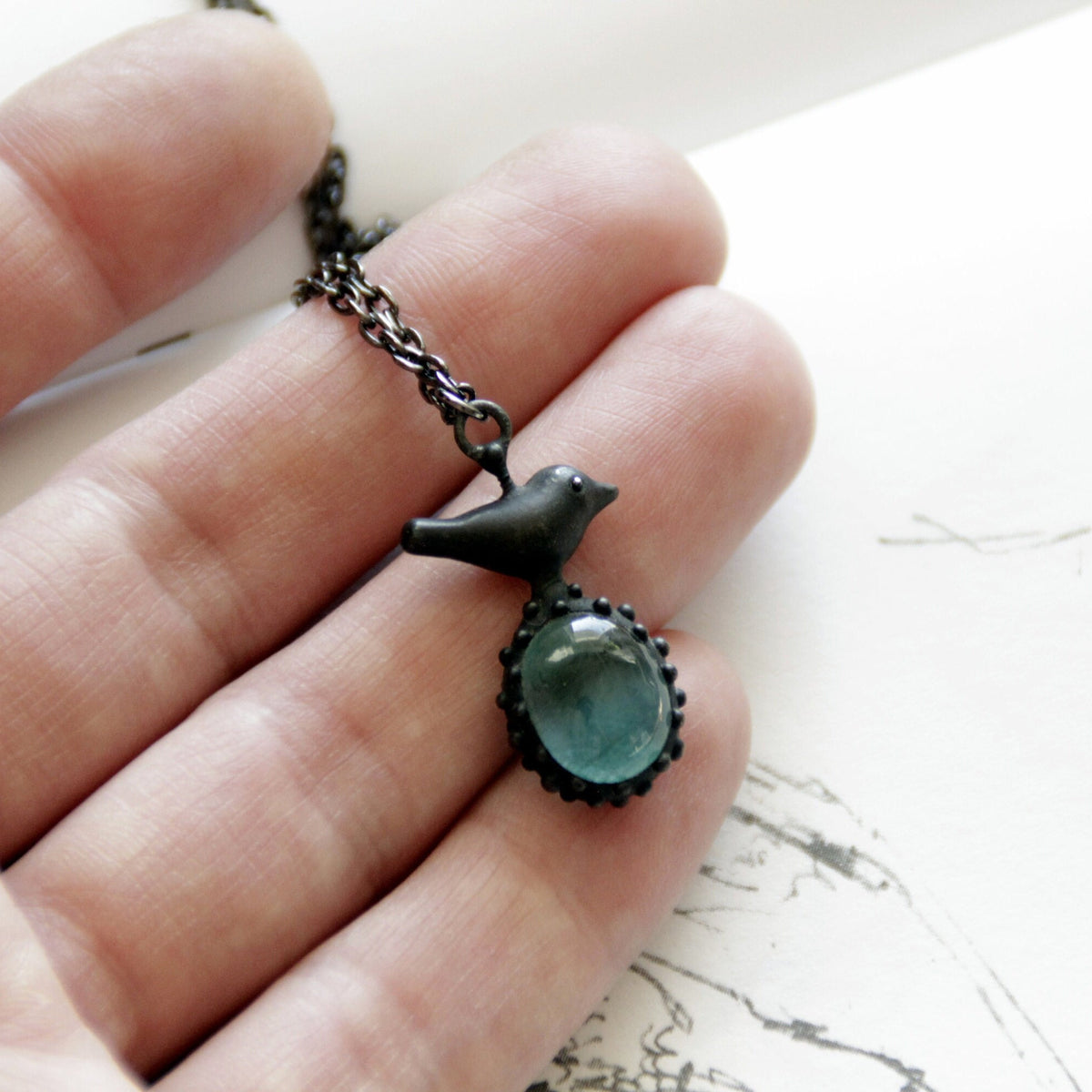 Teal Blue Glass Bird Necklace – Blackened Copper