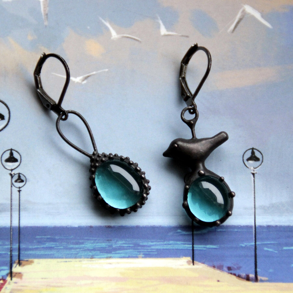 Blue Glass Asymmetrical Bird Earrings – Blackened Copper