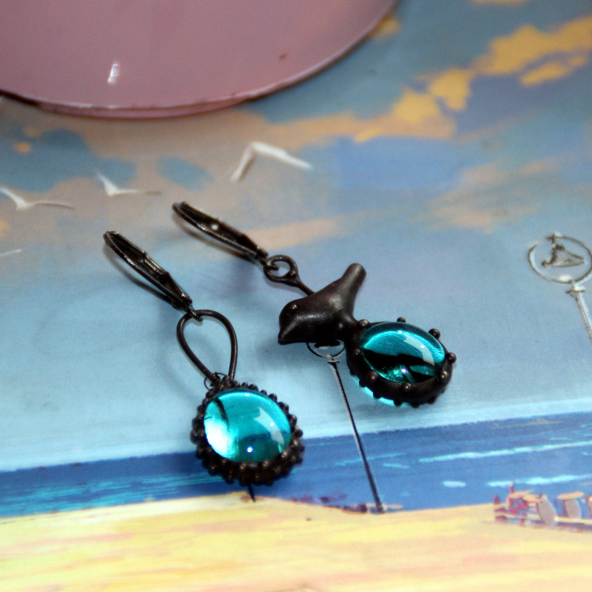 Blue Glass Asymmetrical Bird Earrings – Blackened Copper