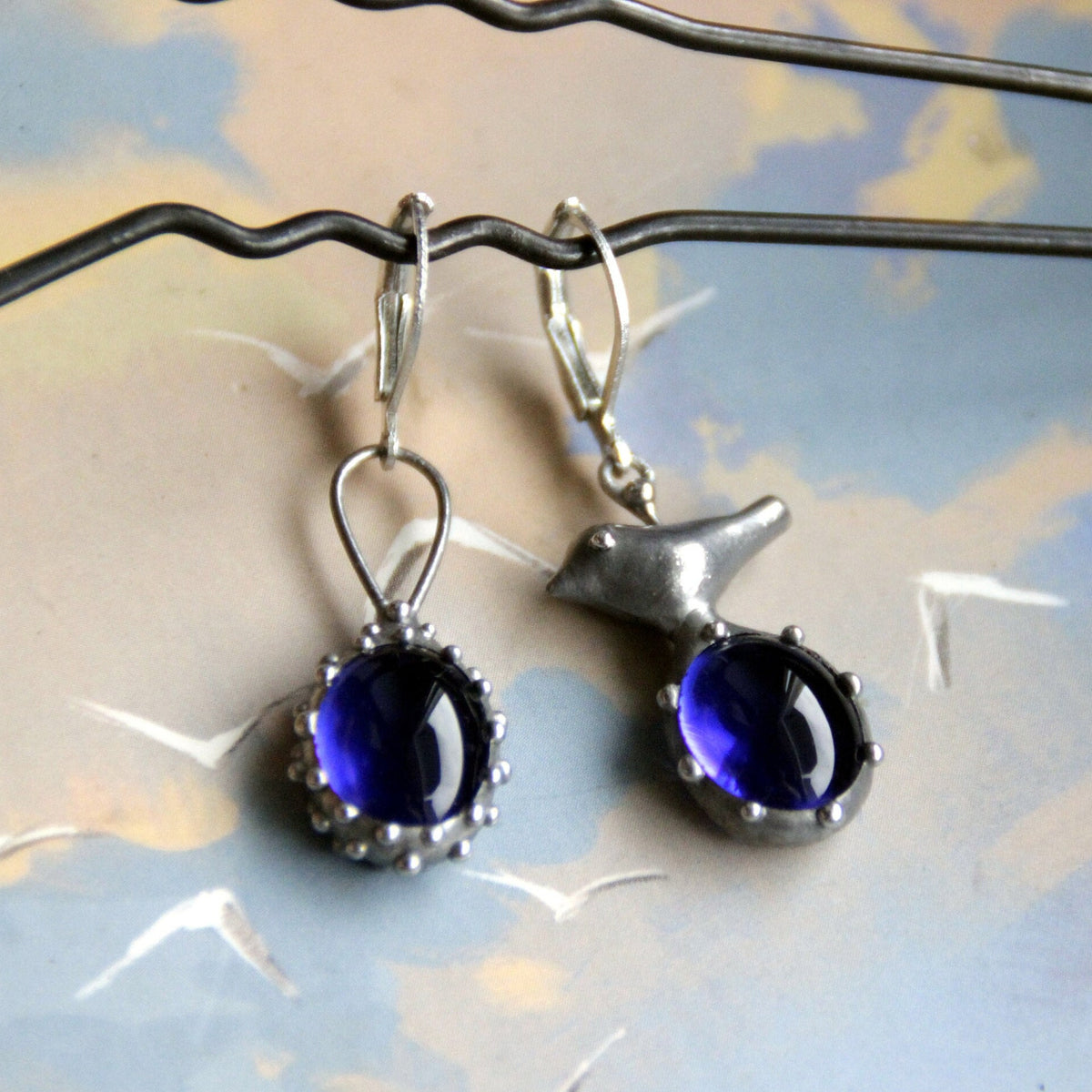 Blue Glass Asymmetrical Bird Earrings – Silver Tone