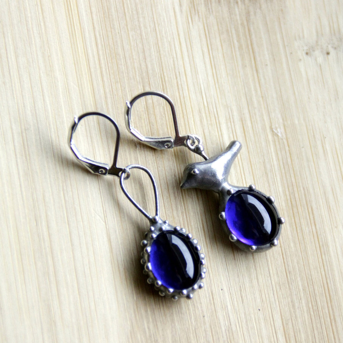 Blue Glass Asymmetrical Bird Earrings – Silver Tone