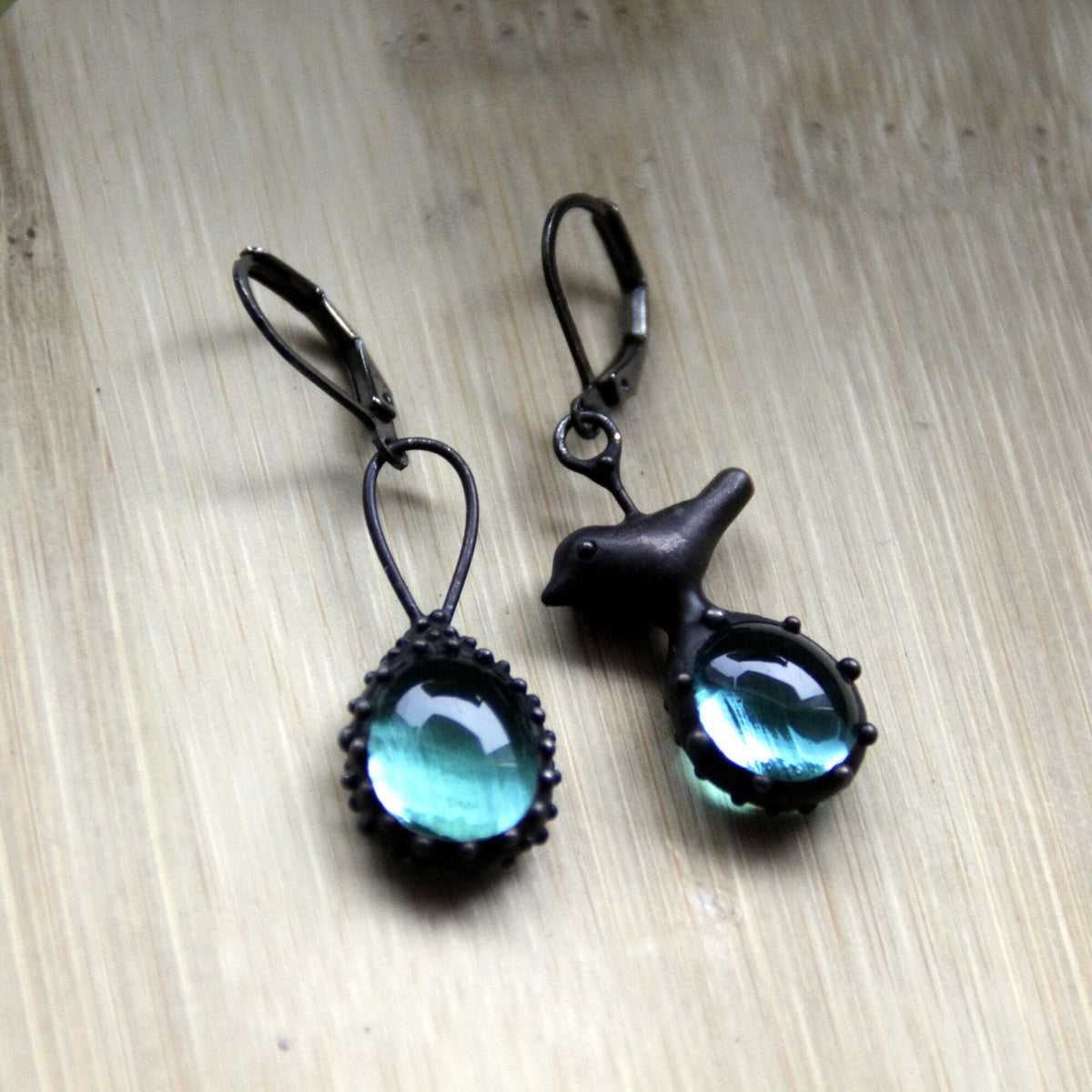Blue Glass Asymmetrical Bird Earrings – Blackened Copper