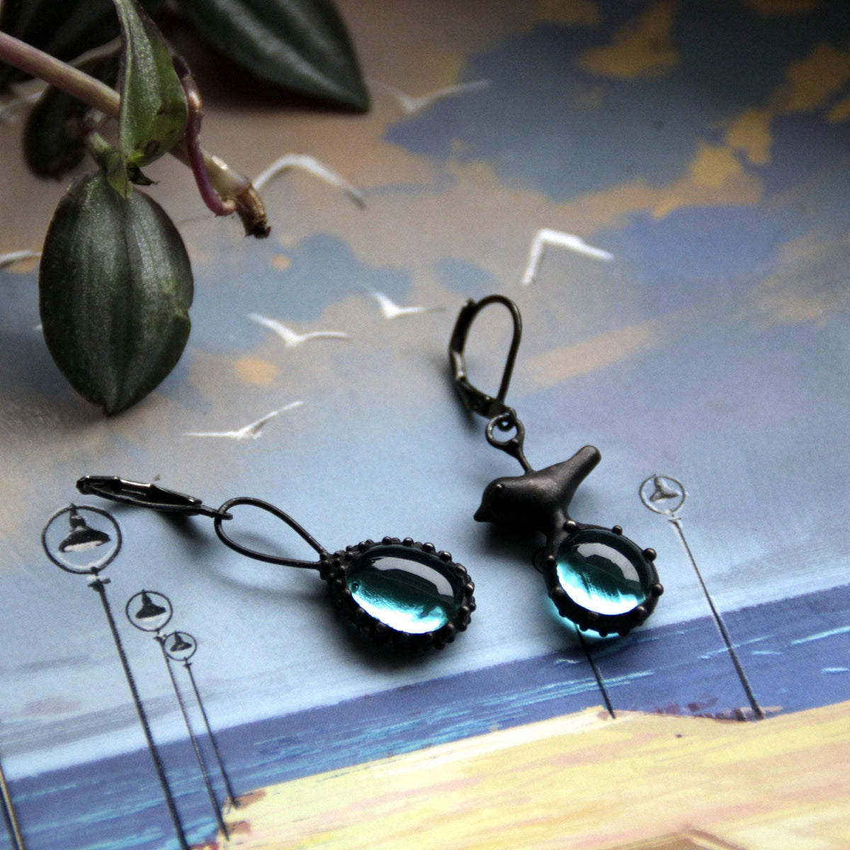 Blue Glass Asymmetrical Bird Earrings – Blackened Copper