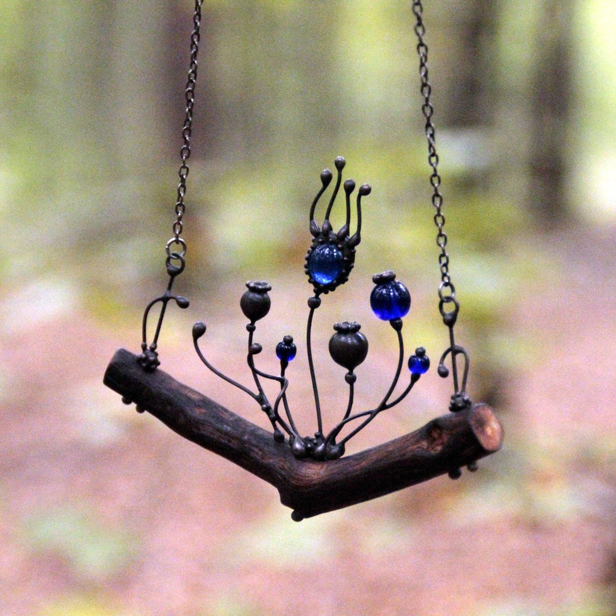 Blue Glass Poppy Necklace on Oak Branch – Blackened Copper