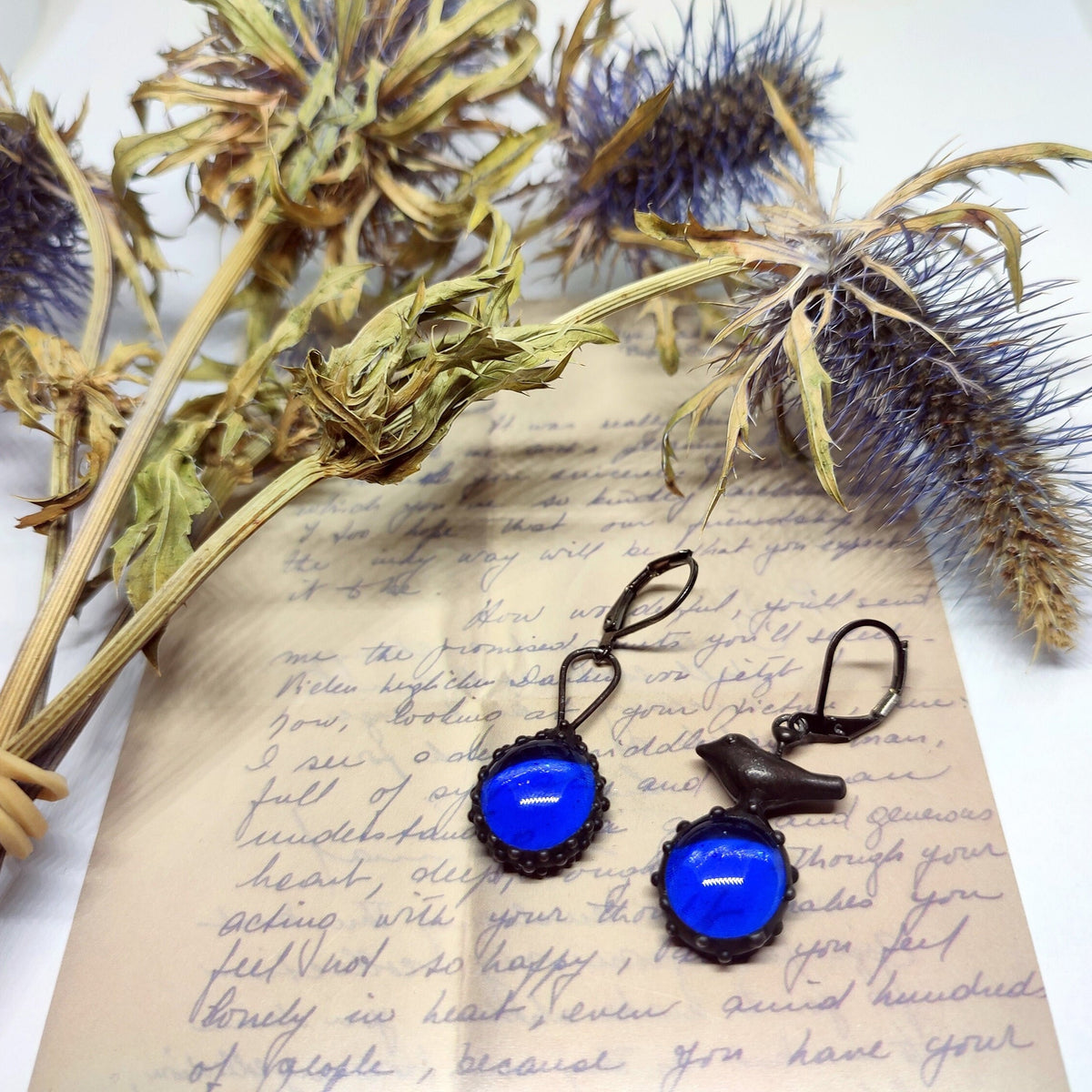 Cobalt Blue Glass Asymmetrical Bird Earrings – Blackened Copper