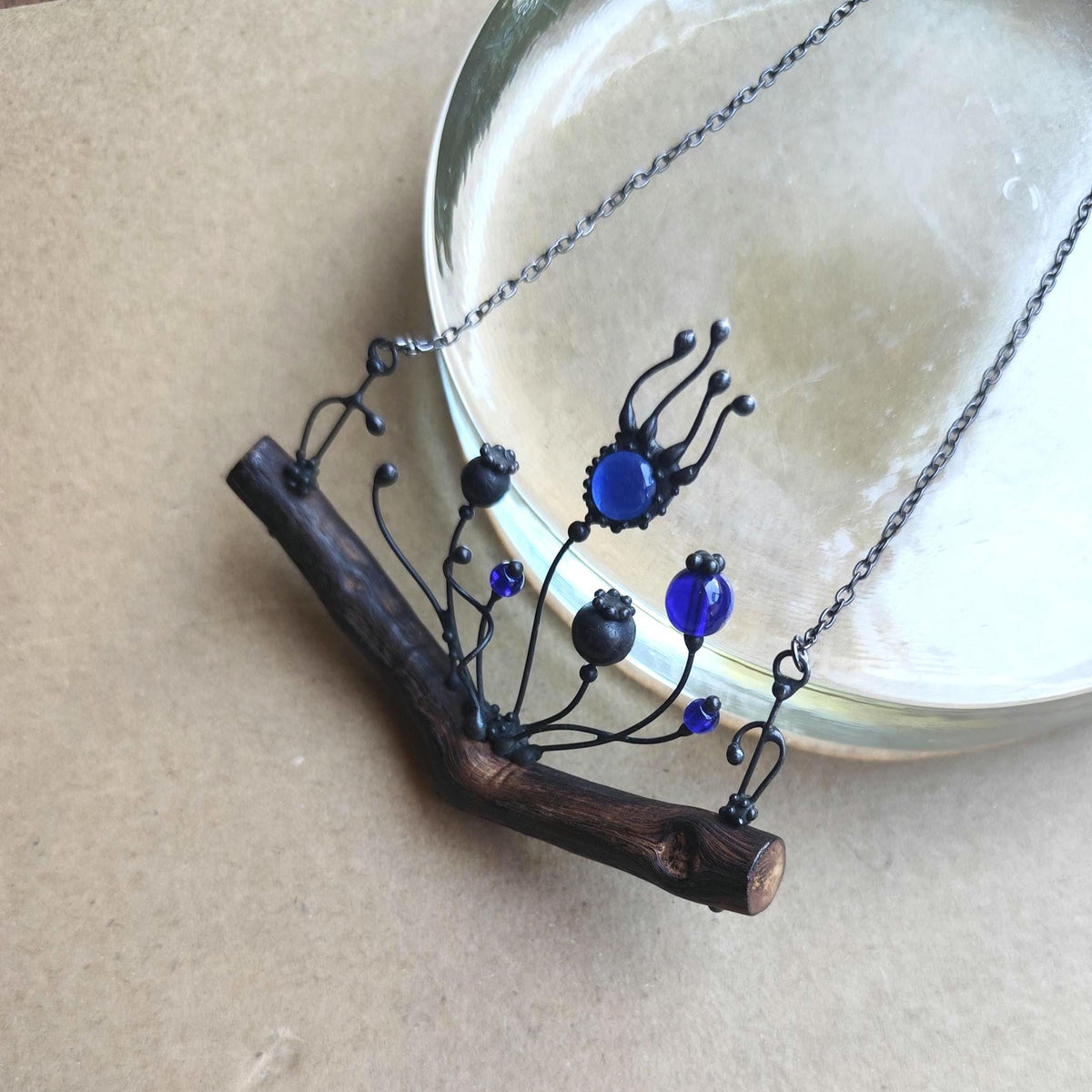 Blue Glass Poppy Necklace on Oak Branch – Blackened Copper