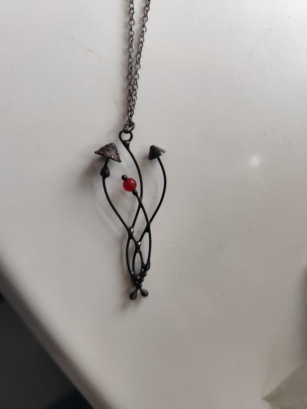 Mushroom Necklace with Red Bead – Blackened Copper